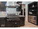 Close up of the kitchen range hood and burners and custom cabinetry at 10415 Charter Oaks, Carmel, IN 46032