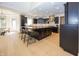 Bright kitchen featuring a large center island with barstool seating, stainless steel appliances and natural lighting at 10415 Charter Oaks, Carmel, IN 46032