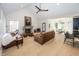 Open-concept living area featuring a fireplace, vaulted ceilings, and seamless flow to the dining area at 10415 Charter Oaks, Carmel, IN 46032