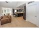 Open-concept living area with hardwood floors, a fireplace, and seamless flow to the kitchen at 10415 Charter Oaks, Carmel, IN 46032