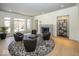 Inviting living room features a modern fireplace, large windows, and stylish seating area at 10415 Charter Oaks, Carmel, IN 46032