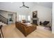 Spacious living room with a fireplace, hardwood floors, and comfortable seating for entertaining at 10415 Charter Oaks, Carmel, IN 46032