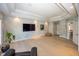 Large living room with hardwood floors, recessed lighting and accent wall at 10415 Charter Oaks, Carmel, IN 46032