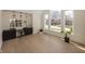 Bright office space featuring custom built-ins, and an abundance of natural light from large windows at 10415 Charter Oaks, Carmel, IN 46032