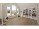 Bright office space with hardwood floors, built-in bookshelves, and large windows for natural light at 10415 Charter Oaks, Carmel, IN 46032
