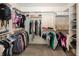 Well-organized walk-in closet with shelving and hanging space for clothing and accessories at 10415 Charter Oaks, Carmel, IN 46032