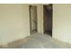 Image shows a bedroom that has been partially renovated with visible stairs and closet at 1056 N Mount St, Indianapolis, IN 46222