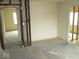 Image shows a bedroom that has been partially renovated with studs visible at 1056 N Mount St, Indianapolis, IN 46222