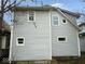 Side view of a two-story home featuring durable siding and well-placed windows for natural light at 1056 N Mount St, Indianapolis, IN 46222