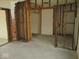 Partially framed room offering a glimpse of exposed brick and renovation potential at 1056 N Mount St, Indianapolis, IN 46222