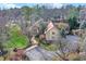 Aerial view of stunning property with mature trees, gorgeous landscaping and circular driveway at 10614 Winterwood, Carmel, IN 46032