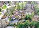 Expansive estate featuring a sprawling lawn, mature trees and a backyard pool at 10614 Winterwood, Carmel, IN 46032