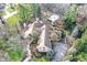 Aerial view of house with mature trees, in-ground pool, and meticulously manicured yard at 10614 Winterwood, Carmel, IN 46032