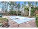 An inground pool covered for the winter sits in a landscaped backyard at 10614 Winterwood, Carmel, IN 46032