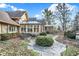 Spacious backyard with beautiful stone patio, lush landscaping and beautiful sunroom at 10614 Winterwood, Carmel, IN 46032