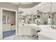 Bathroom with and sinks, marble floors, and many mirrors at 10614 Winterwood, Carmel, IN 46032