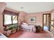 Floral themed bedroom with floral wallpaper and carpet, with a daybed and large window at 10614 Winterwood, Carmel, IN 46032