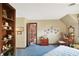 Bedroom with patterned wallpaper, blue carpet, wood trim and an open door to another room at 10614 Winterwood, Carmel, IN 46032