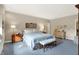 Serene bedroom with soft blue accents, floral patterned wallpaper, and well-placed lamps at 10614 Winterwood, Carmel, IN 46032