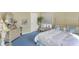 Bedroom with blue patterned carpet, wallpapered walls and a full sized bed at 10614 Winterwood, Carmel, IN 46032