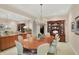 Formal dining room with a large table, chandelier, and ample space for entertaining guests at 10614 Winterwood, Carmel, IN 46032