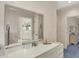 This dressing room features a large mirror, white drawers, and stylish accents at 10614 Winterwood, Carmel, IN 46032