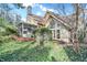 Beautiful stone and siding home with a screened in porch and lots of windows at 10614 Winterwood, Carmel, IN 46032