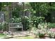 Secluded gazebo with flowering plants and a bench, perfect for relaxing at 10614 Winterwood, Carmel, IN 46032