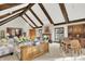 Inviting living room showcases wood beams, fireplace, hardwood floors, with views of outdoor scenery at 10614 Winterwood, Carmel, IN 46032