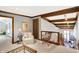 A carpeted upstairs loft with views of the floor below and dark wood trim at 10614 Winterwood, Carmel, IN 46032