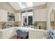 Bright home office featuring built-in desk, storage, and a large window, providing an efficient workspace at 10614 Winterwood, Carmel, IN 46032