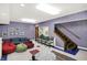 Large recreation room with staircase and lounge area at 10614 Winterwood, Carmel, IN 46032