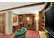 Climate-controlled wine cellar with glass doors, wine racks, and wood accents at 10614 Winterwood, Carmel, IN 46032
