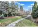 Beautiful walkway through mature trees and yard with lush landscaping at 10614 Winterwood, Carmel, IN 46032