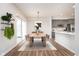 Elegant dining area with modern lighting, stylish decor, and seamless access to the kitchen and outdoor space for easy entertaining at 10628 Mangrove Dr, Indianapolis, IN 46239