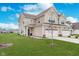 Charming two-story home featuring a well-manicured lawn, two-car garage, and a welcoming entrance with tasteful landscaping at 10628 Mangrove Dr, Indianapolis, IN 46239