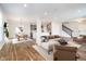 Inviting open-concept layout connecting the living room, dining area, and kitchen, perfect for modern living and entertaining guests at 10628 Mangrove Dr, Indianapolis, IN 46239