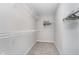 Walk-in closet with white wire shelving and neutral carpeting at 10628 Mangrove Dr, Indianapolis, IN 46239