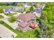 An aerial view of the home showing its deck, lush yard, and surrounding neighborhood at 10792 Harbor Bay Dr, Fishers, IN 46040