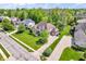 Aerial view of an elegant home, showcasing its landscaped yard and long driveway at 10792 Harbor Bay Dr, Fishers, IN 46040