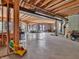 Unfinished basement space featuring concrete floor, exposed wood frame, and natural light at 10792 Harbor Bay Dr, Fishers, IN 46040