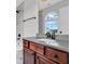 Vanity featuring a black faucet, granite countertops, and tiled backsplash at 10792 Harbor Bay Dr, Fishers, IN 46040