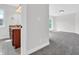 Bathroom featuring wooden vanity, neutral walls, and gray tile flooring at 10792 Harbor Bay Dr, Fishers, IN 46040