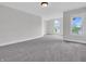Large bedroom with a neutral color palette, large windows, and carpet flooring at 10792 Harbor Bay Dr, Fishers, IN 46040