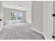 Bright bedroom featuring soft gray carpet, neutral walls, and a double window view at 10792 Harbor Bay Dr, Fishers, IN 46040