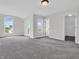 Large bedroom with a neutral color palette, large windows, and carpet flooring at 10792 Harbor Bay Dr, Fishers, IN 46040