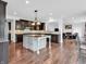 Spacious kitchen featuring dark cabinetry, a center island, and stainless steel appliances at 10792 Harbor Bay Dr, Fishers, IN 46040