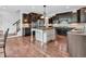 Spacious kitchen featuring dark cabinetry, a center island, and stainless steel appliances at 10792 Harbor Bay Dr, Fishers, IN 46040