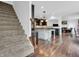 Open-plan kitchen with a large island, stainless steel appliances, and hardwood floors at 10792 Harbor Bay Dr, Fishers, IN 46040