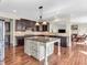 Spacious kitchen featuring dark cabinetry, a center island, and stainless steel appliances at 10792 Harbor Bay Dr, Fishers, IN 46040